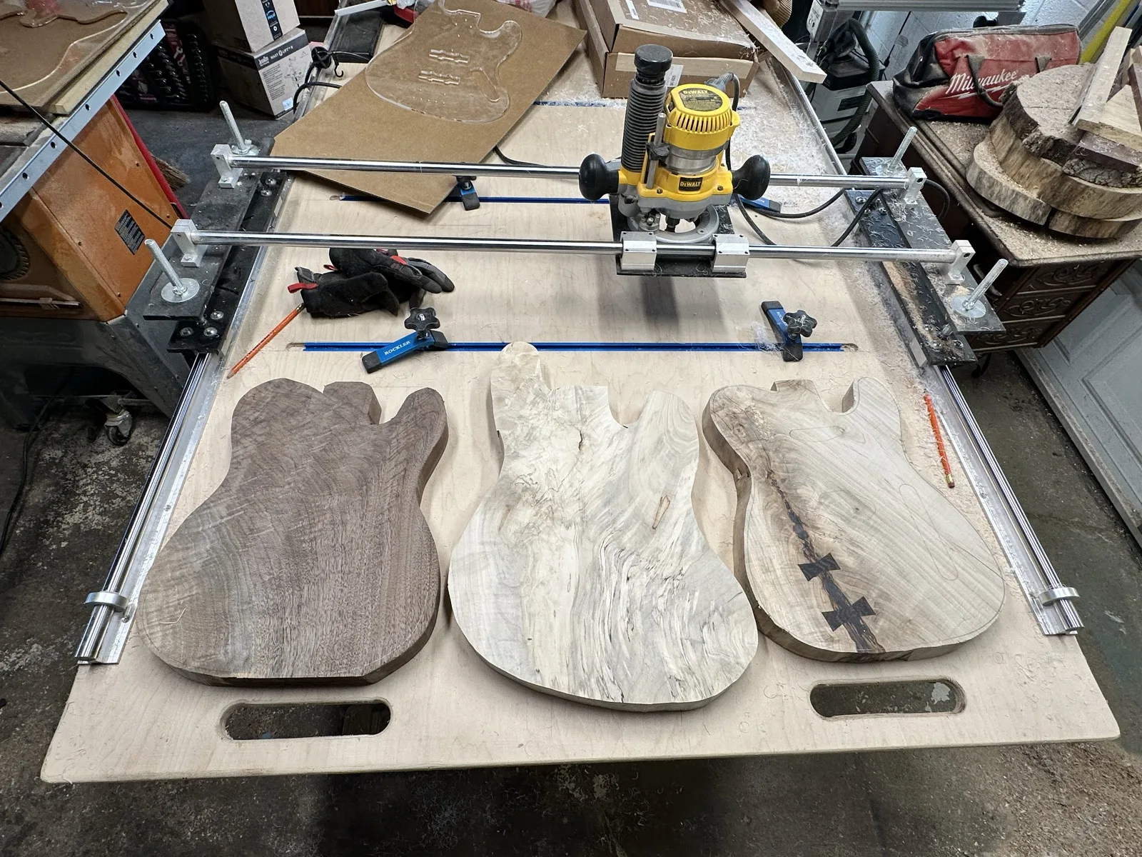 Three guitar body blanks cut on a router table