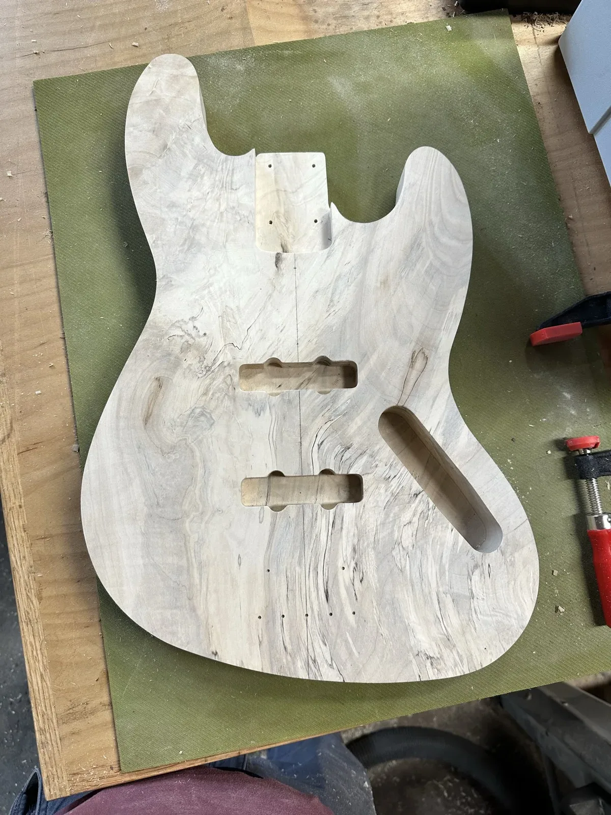 Routed guitar body cavities for pickups and electronics