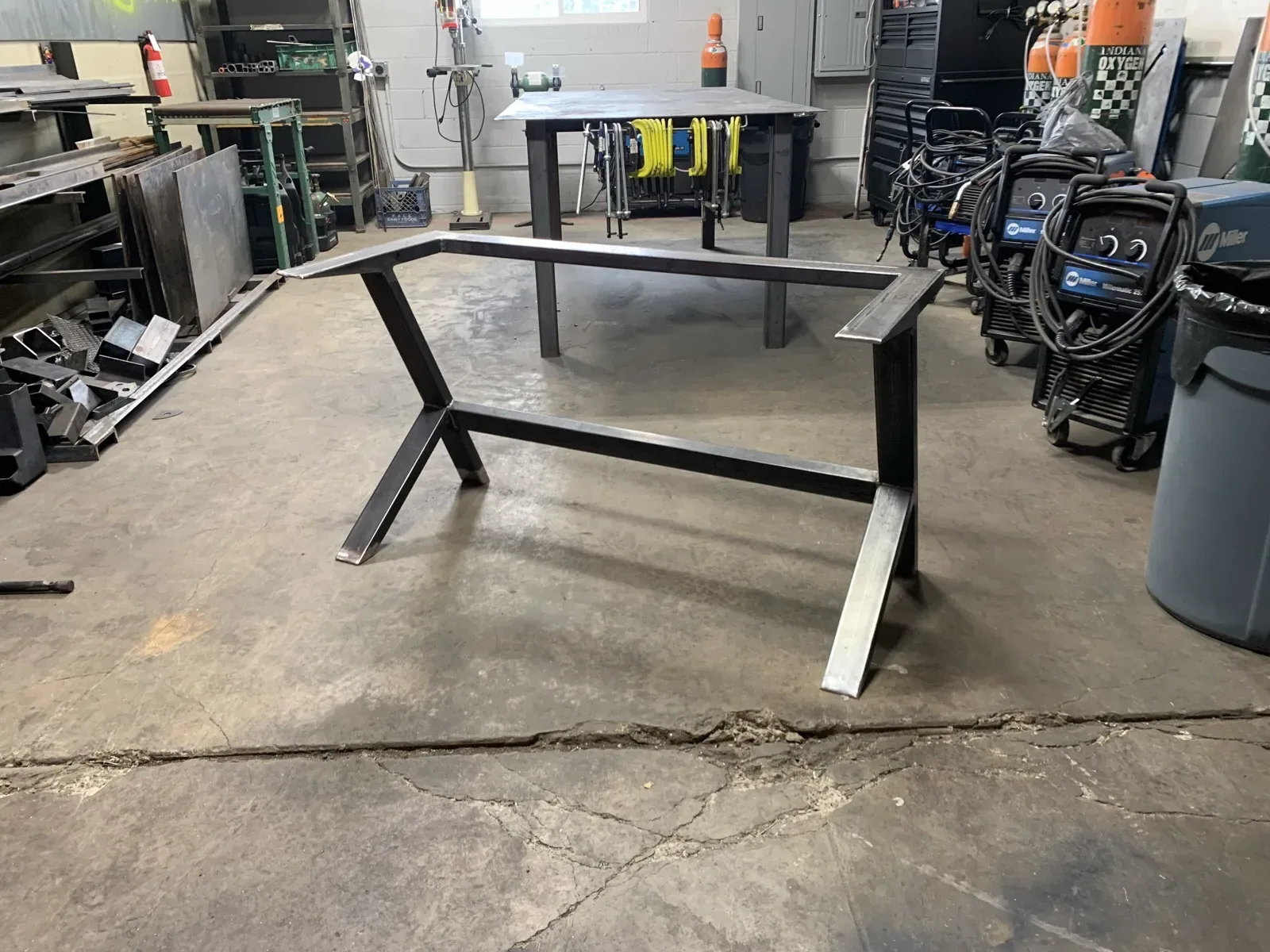 Steel storage brackets welded to a garage ceiling
