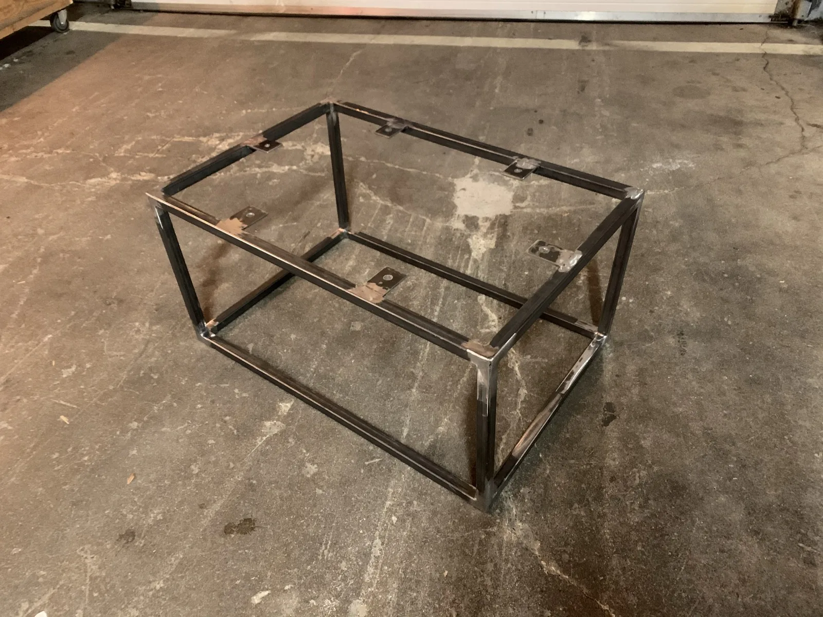 Steel scissor lift table mounted upside down for storage