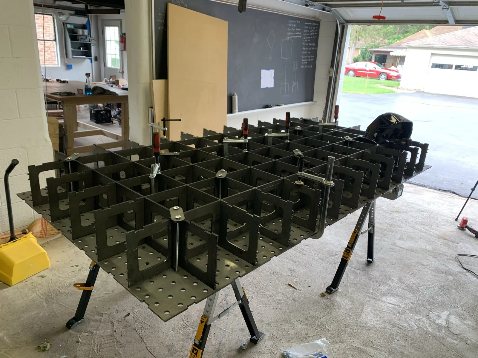Large modular welding table with a grid of steel dividers
