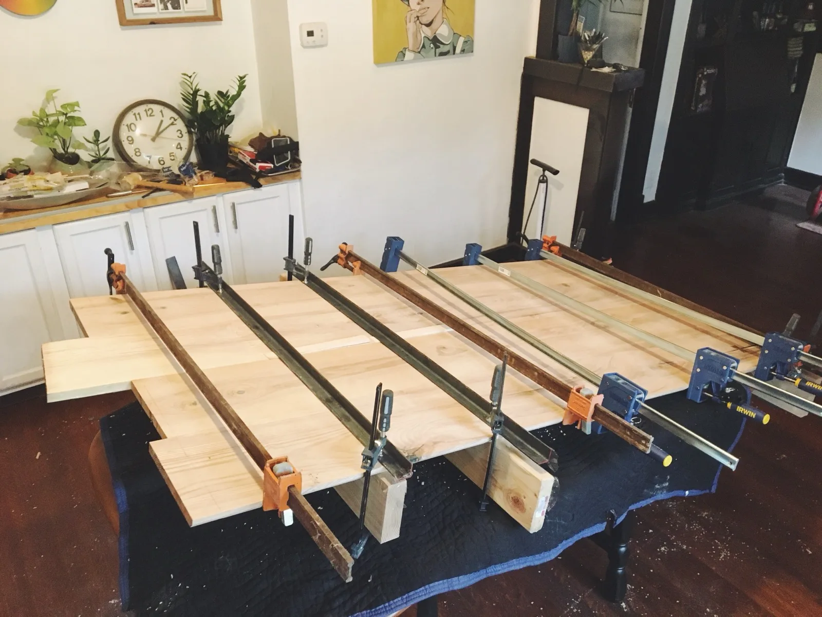 Live-edge boards clamped together for glue-up