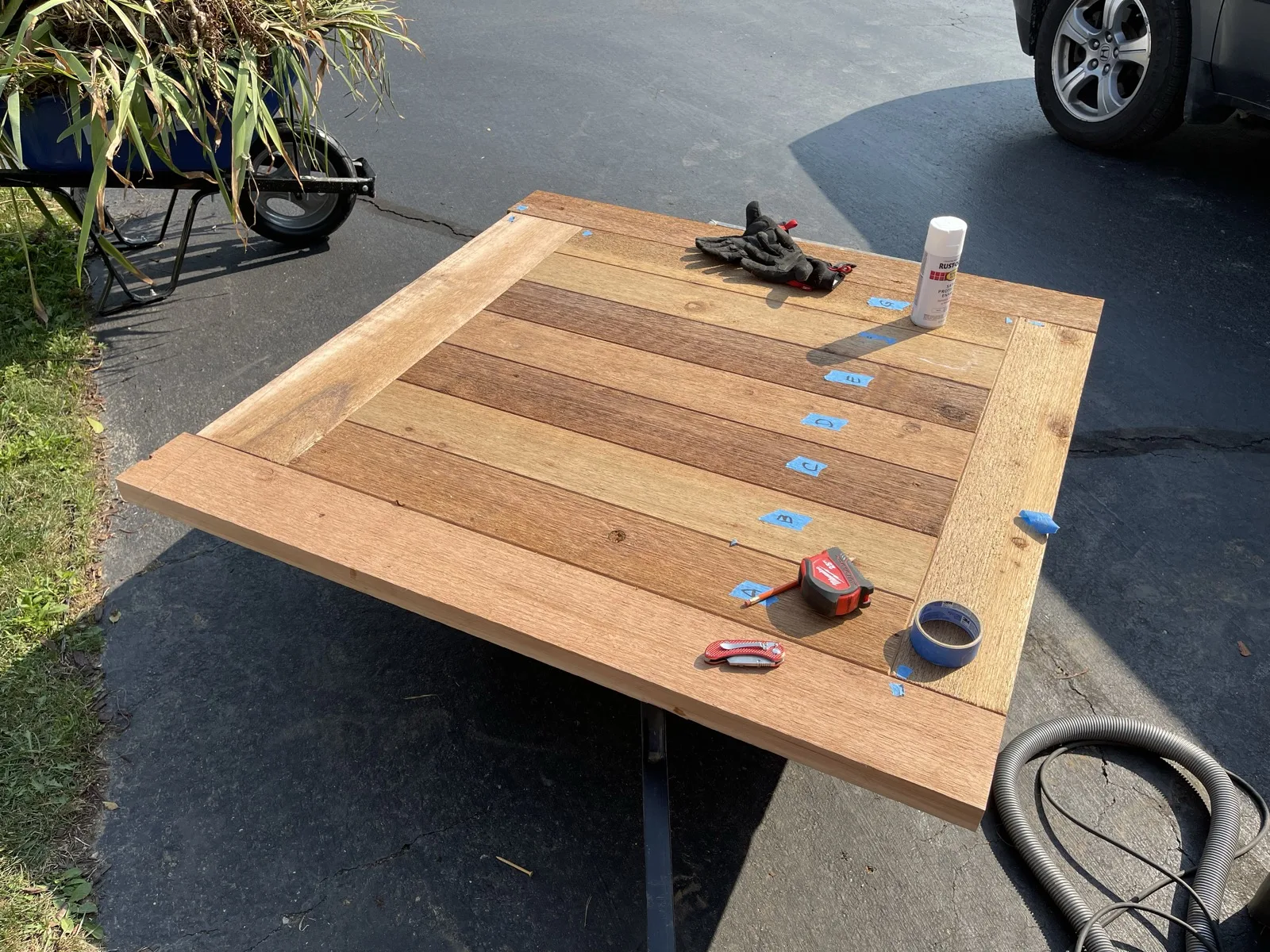 Outdoor deck table top with painter's-tape board labels