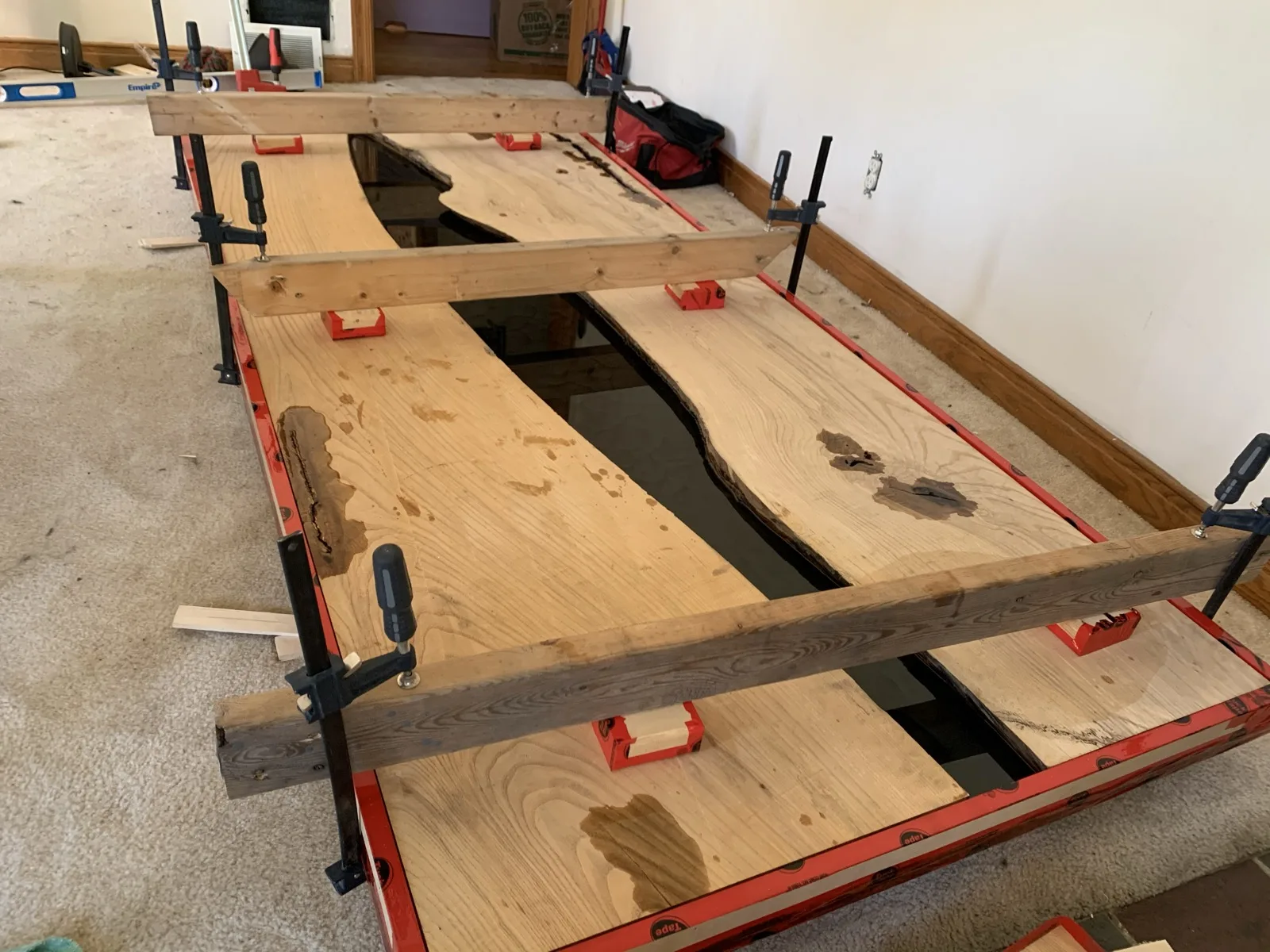 Live-edge epoxy river table top in progress