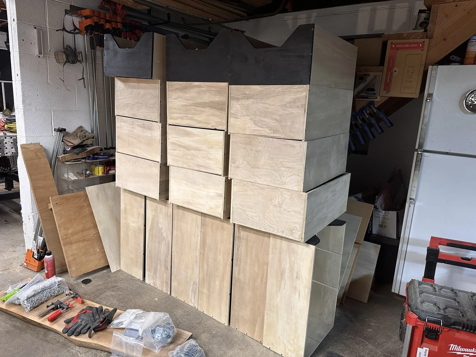 Stack of modular plywood drawer units in progress